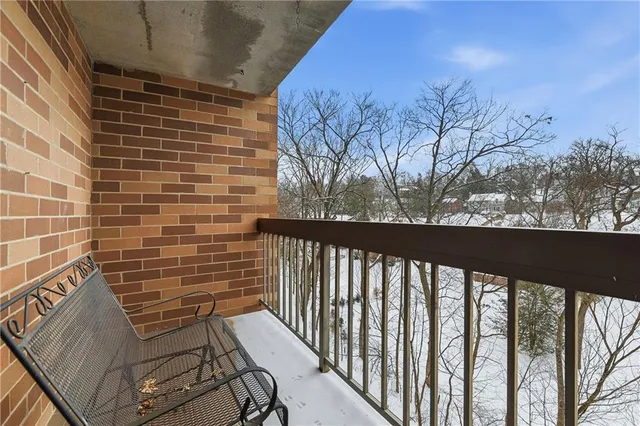 a view of a balcony with wooden floor and outdoor space