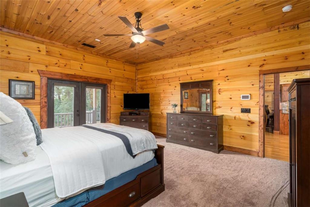 31 High Cliff Road Jasper, GA 30143 - Photo 13 of 50 a bedroom with a bed and wooden floor