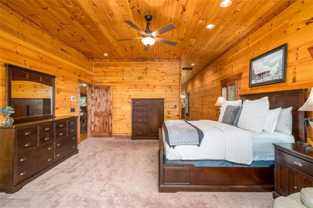 31 High Cliff Road Jasper, GA 30143 - Photo 14 of 50 a spacious bedroom with a bed and a dresser