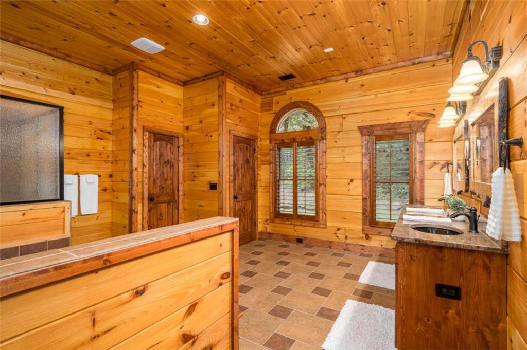 31 High Cliff Road Jasper, GA 30143 - Photo 16 of 50 a view of a porch with a couch and wooden floor