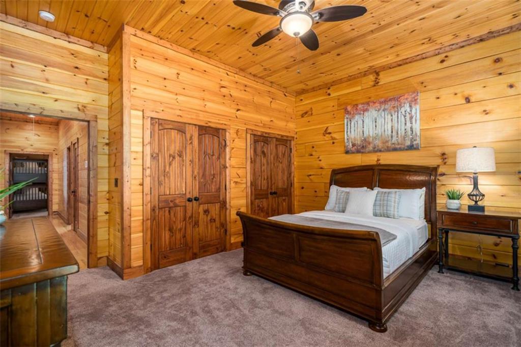 31 High Cliff Road Jasper, GA 30143 - Photo 20 of 50 a spacious bedroom with a bed and a tv