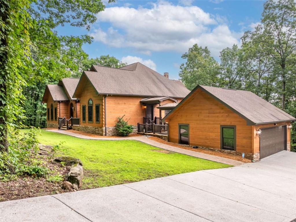 31 High Cliff Road Jasper, GA 30143 - Photo 42 of 50 a front view of a house with yard and green space
