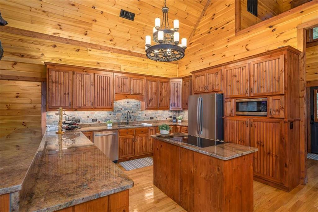 31 High Cliff Road Jasper, GA 30143 - Photo 5 of 50 a kitchen with stainless steel appliances granite countertop a stove a sink dishwasher and a refrigerator