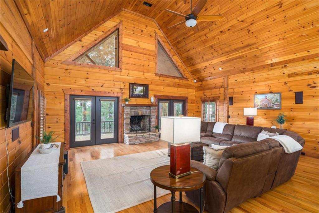 31 High Cliff Road Jasper, GA 30143 - Photo 9 of 50 a outdoor space with patio the couches and a fireplace