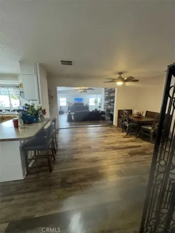 a room with wooden floor and furniture