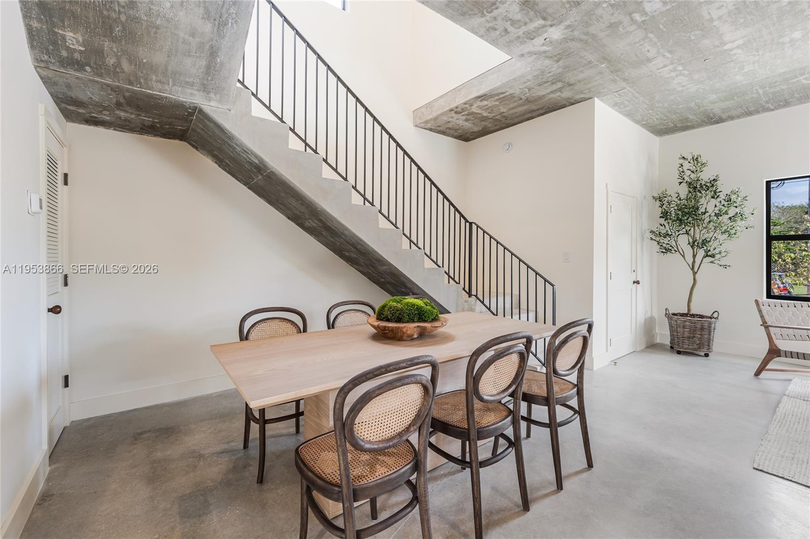 3603 Thomas Avenue Miami, FL 33133 - Photo 12 of 29 a dining room with furniture and entryway