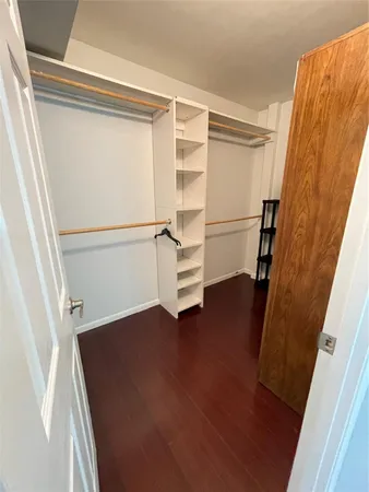 an entryway in a hall with wooden floor