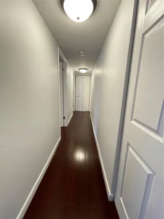 a bedroom with a bed and a mirror