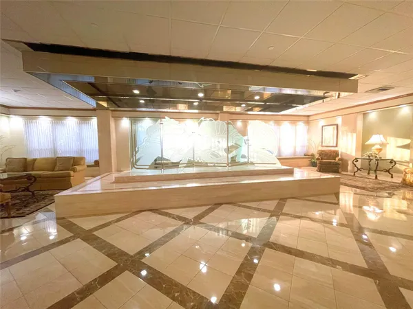 a bedroom with a large bed and a large window