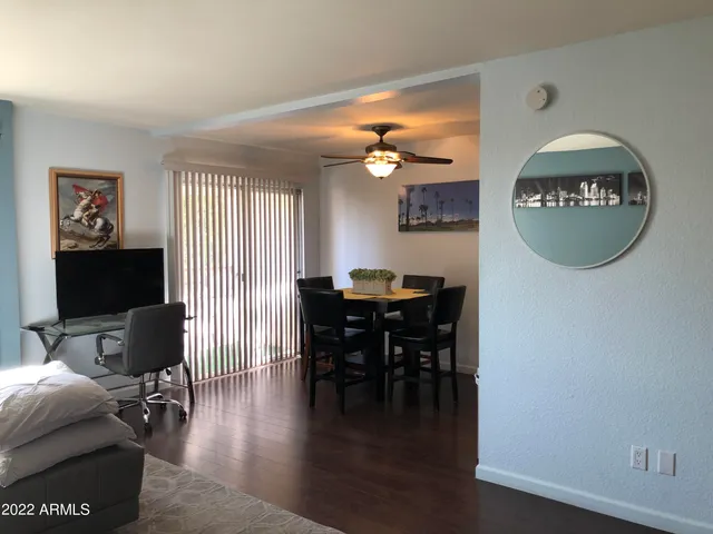 a view of a livingroom with furniture and a window