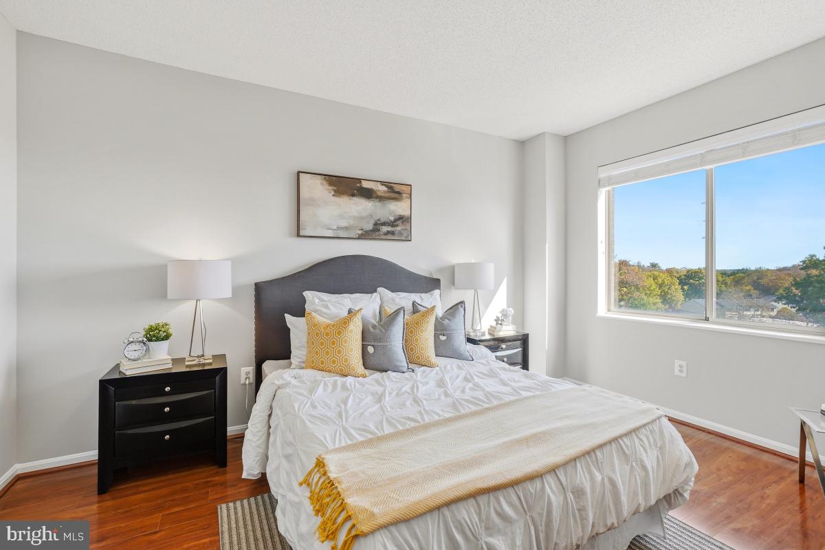 3005 South Leisure World Boulevard, Unit 624 Silver Spring, MD 20906 - Photo 17 of 53 a bedroom with a bed and a window