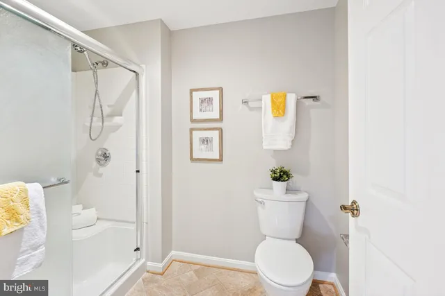 a bathroom with a toilet a sink and tub