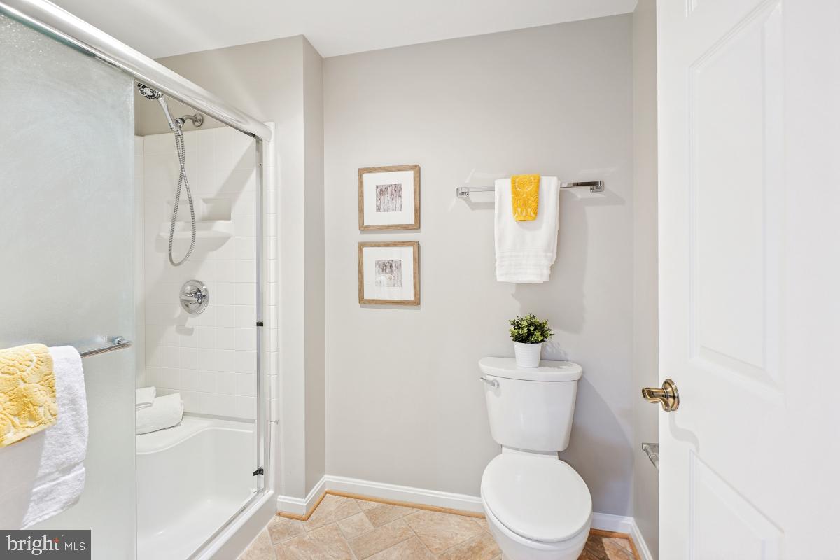 3005 South Leisure World Boulevard, Unit 624 Silver Spring, MD 20906 - Photo 20 of 53 a bathroom with a toilet a sink and tub