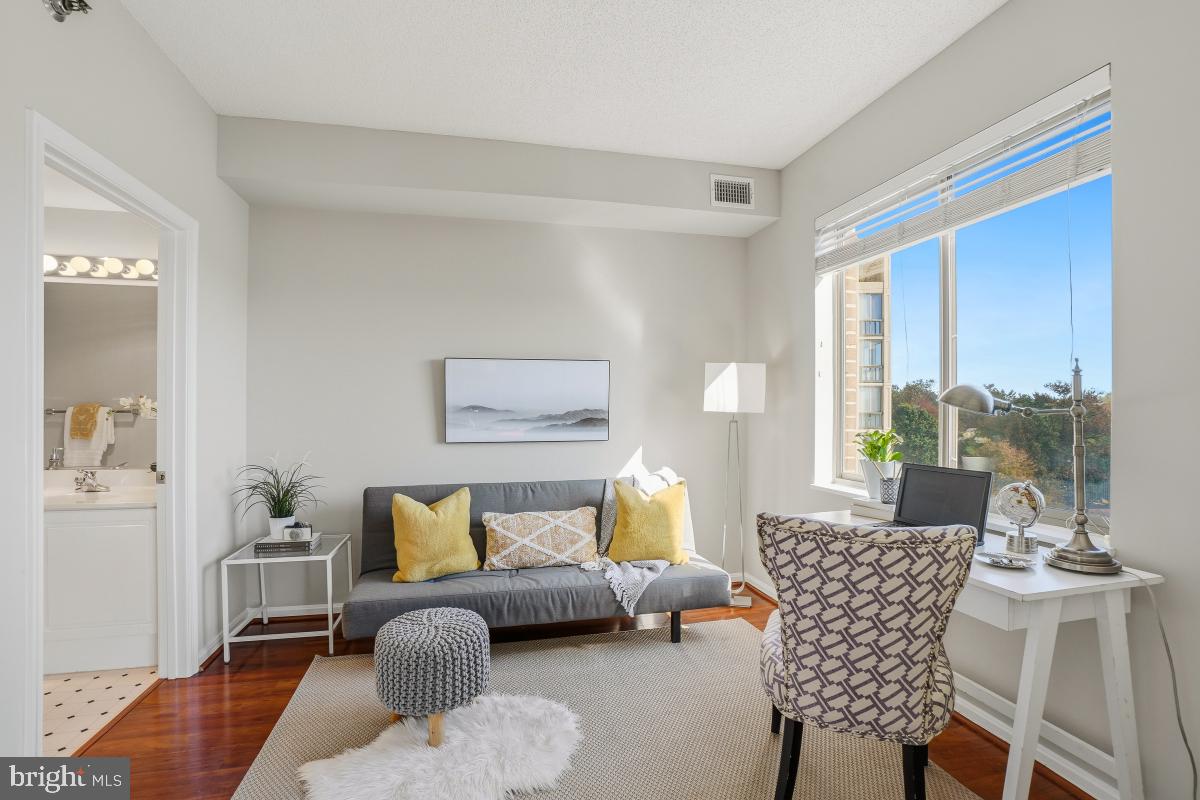 3005 South Leisure World Boulevard, Unit 624 Silver Spring, MD 20906 - Photo 22 of 53 a living room with furniture and a large window