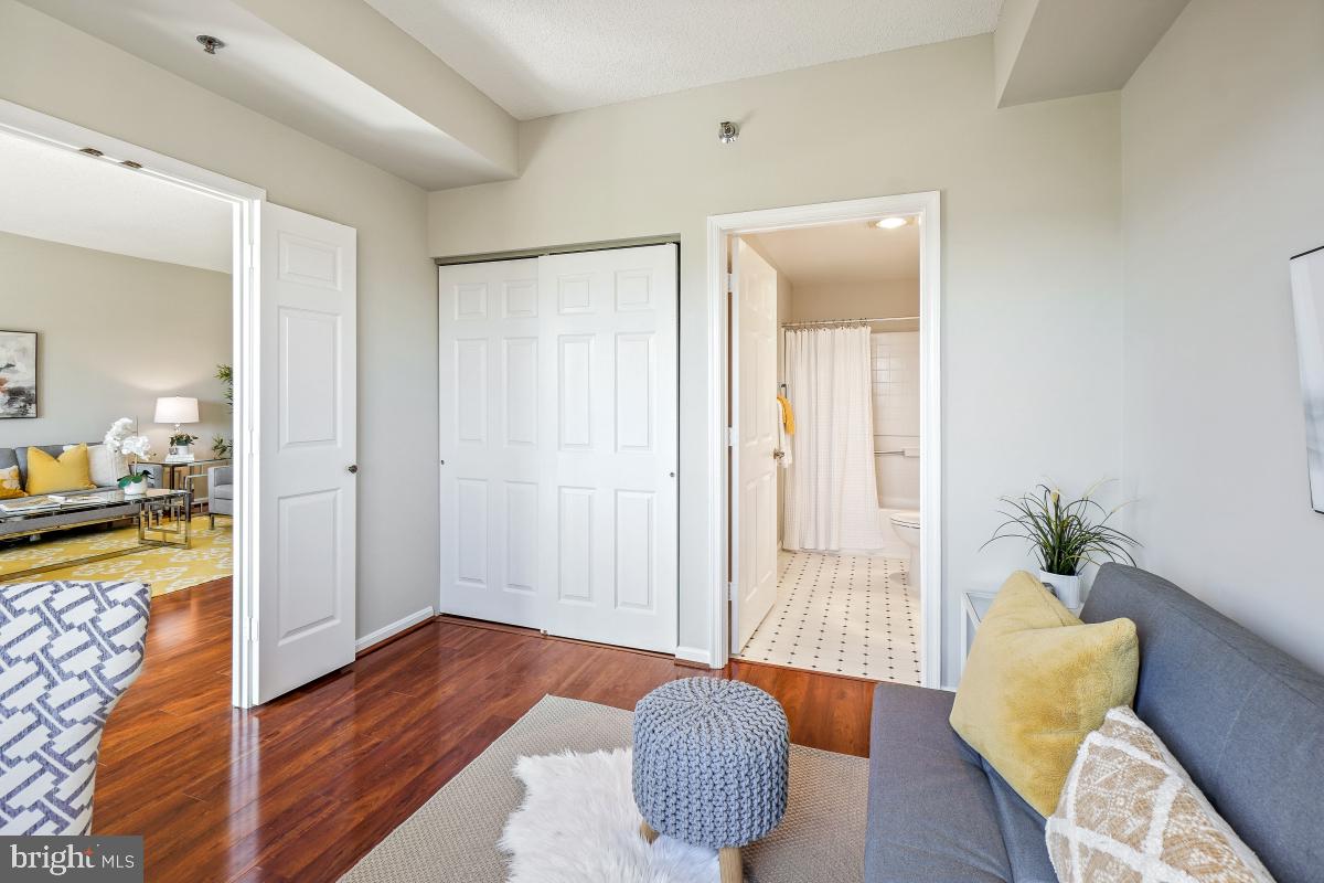 3005 South Leisure World Boulevard, Unit 624 Silver Spring, MD 20906 - Photo 24 of 53 a bedroom with furniture and wooden floor