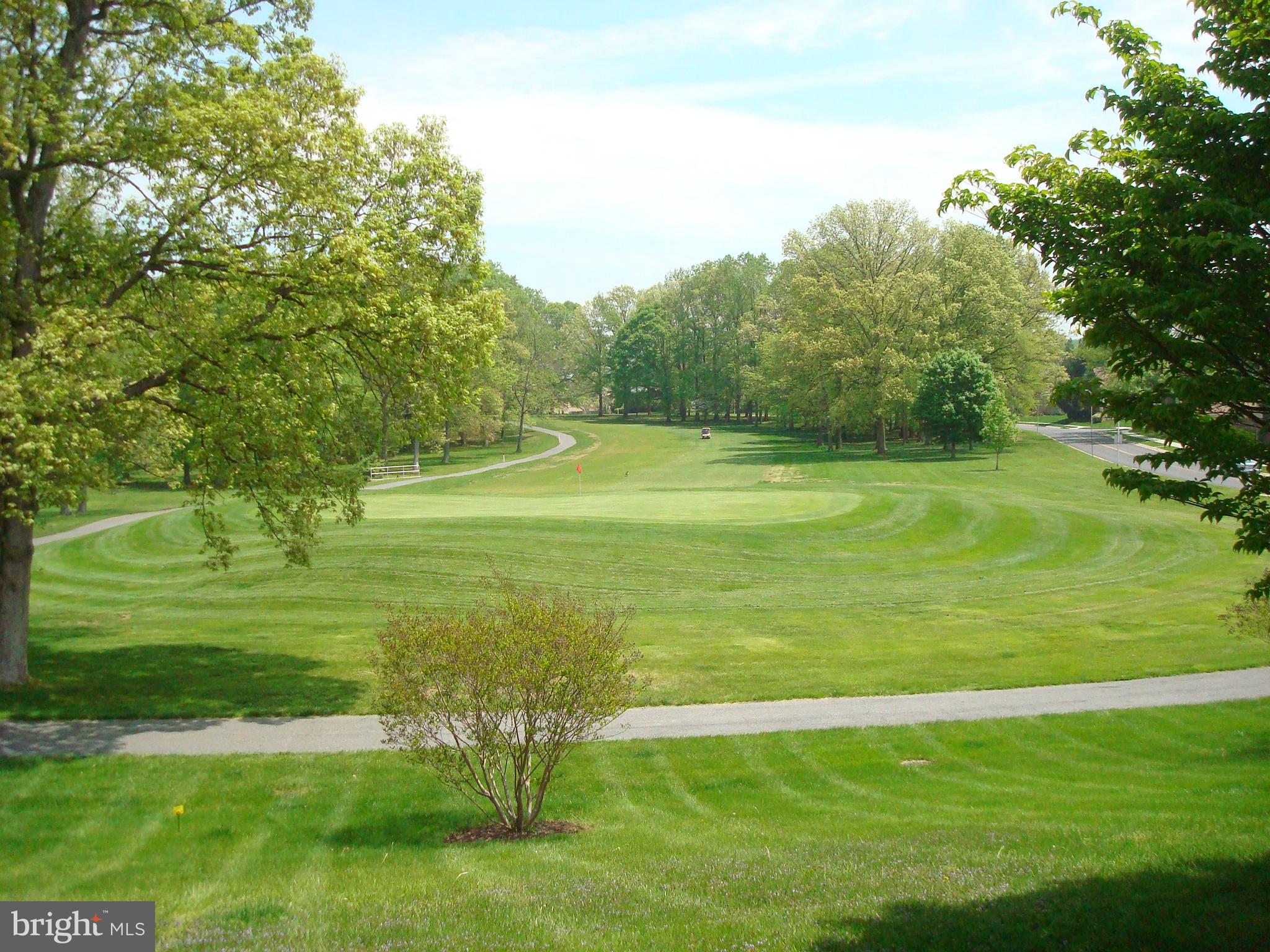 3005 South Leisure World Boulevard, Unit 624 Silver Spring, MD 20906 - Photo 31 of 53 a view of a golf course with a garden