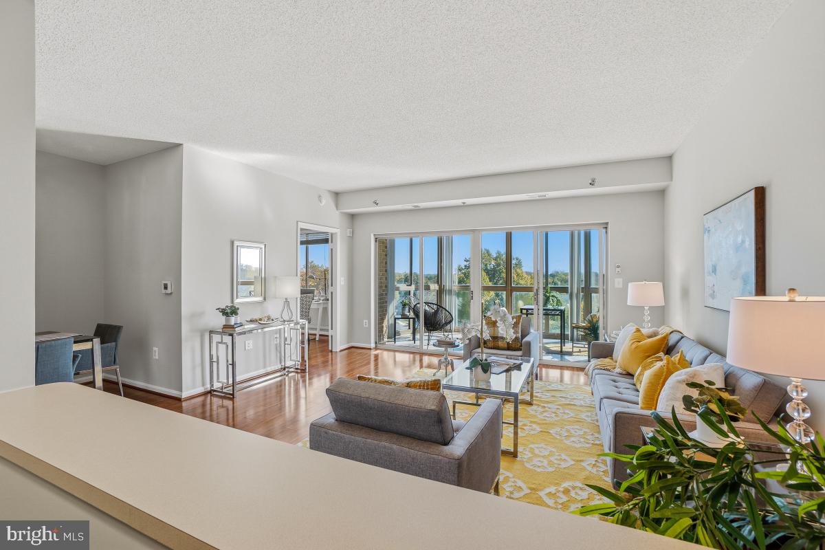 3005 South Leisure World Boulevard, Unit 624 Silver Spring, MD 20906 - Photo 9 of 53 a living room with furniture and a large window