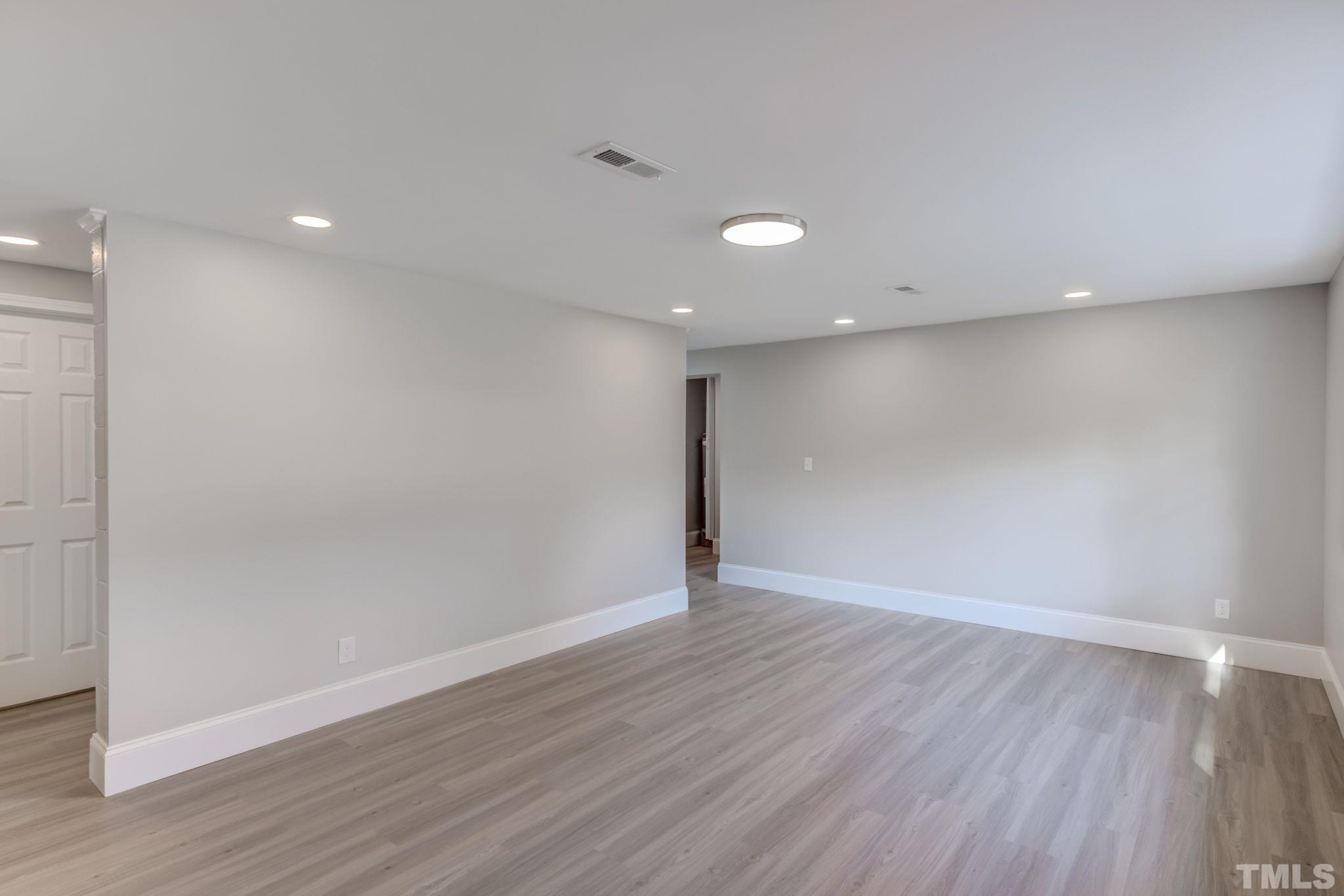 9800 Fanny Brown Road Raleigh, NC 27603 - Photo 14 of 29 a view of an empty room with wooden floor
