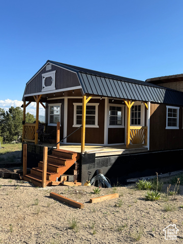 46205 Little Elk Road Fruitland, UT 84027 - Photo 3 of 24 View of front of home with a porch and metal roof