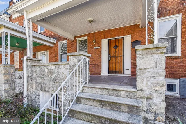 a view of front door of house with stairs
