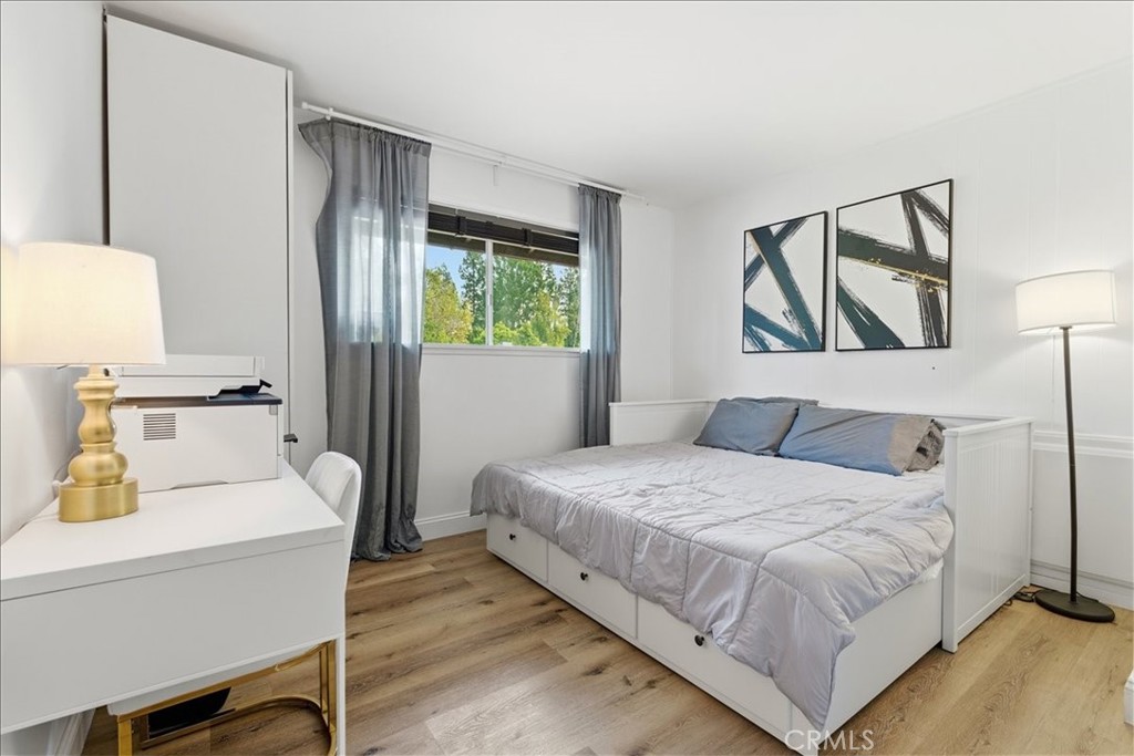 11413 Etiwanda Avenue Porter Ranch, CA 91326 - Photo 18 of 49 a bedroom with a bed and a table