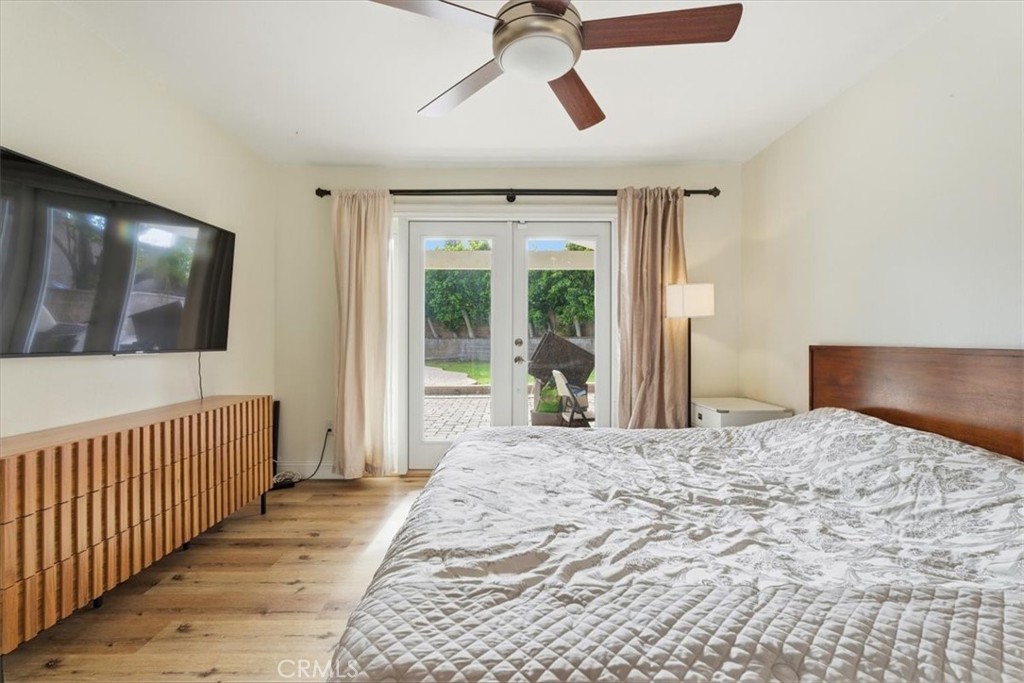 11413 Etiwanda Avenue Porter Ranch, CA 91326 - Photo 31 of 49 a bedroom with a bed and a flat screen tv