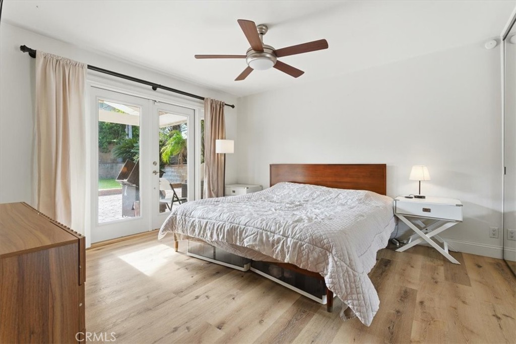 11413 Etiwanda Avenue Porter Ranch, CA 91326 - Photo 32 of 49 a bedroom with a large bed and a large window