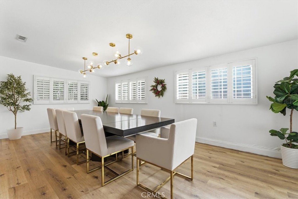 11413 Etiwanda Avenue Porter Ranch, CA 91326 - Photo 35 of 49 a dining room with furniture and window