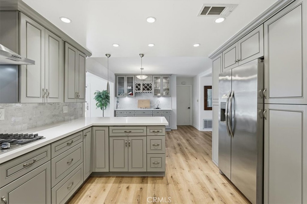 11413 Etiwanda Avenue Porter Ranch, CA 91326 - Photo 36 of 49 a kitchen with a sink stainless steel appliances and cabinets