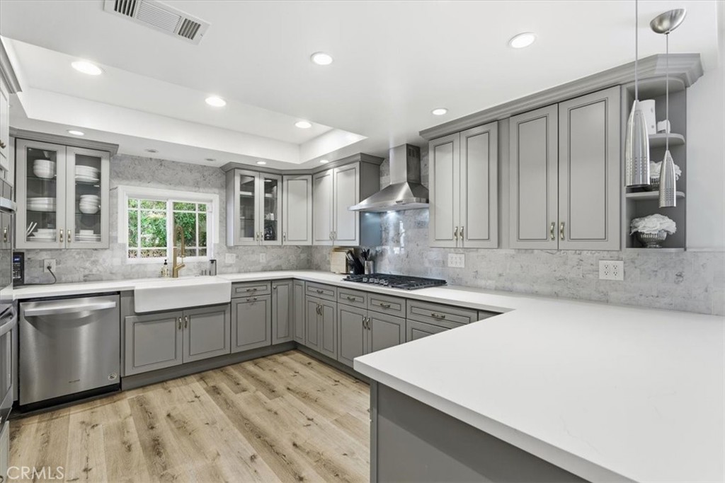 11413 Etiwanda Avenue Porter Ranch, CA 91326 - Photo 40 of 49 a kitchen with sink cabinets and window