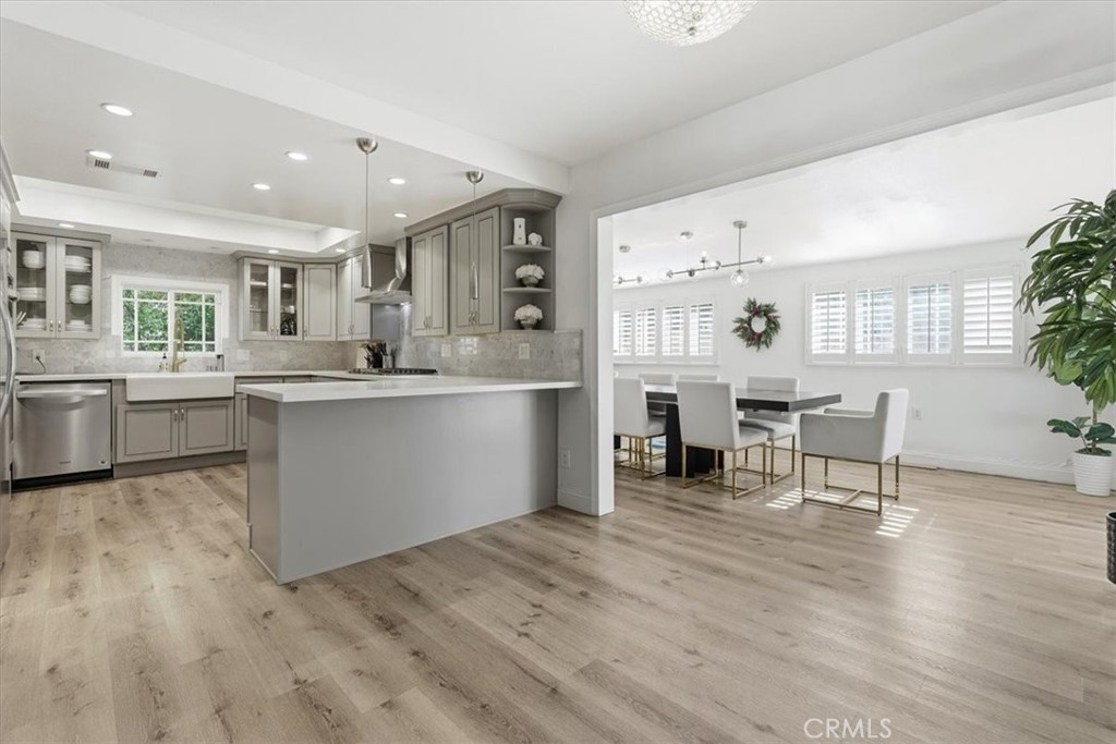 11413 Etiwanda Avenue Porter Ranch, CA 91326 - Photo 42 of 49 a living room with furniture and a kitchen