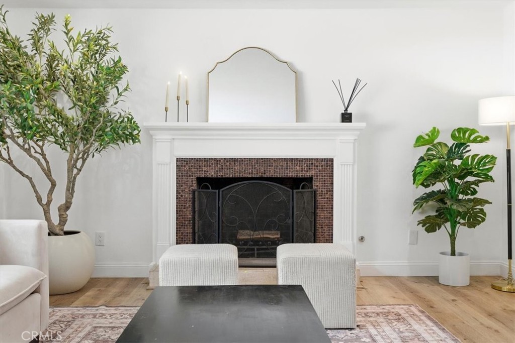 11413 Etiwanda Avenue Porter Ranch, CA 91326 - Photo 45 of 49 a living room with furniture and a potted plant