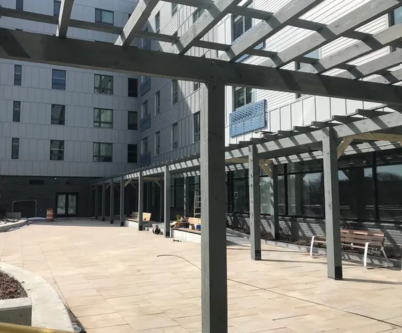 a view of roof deck with patio
