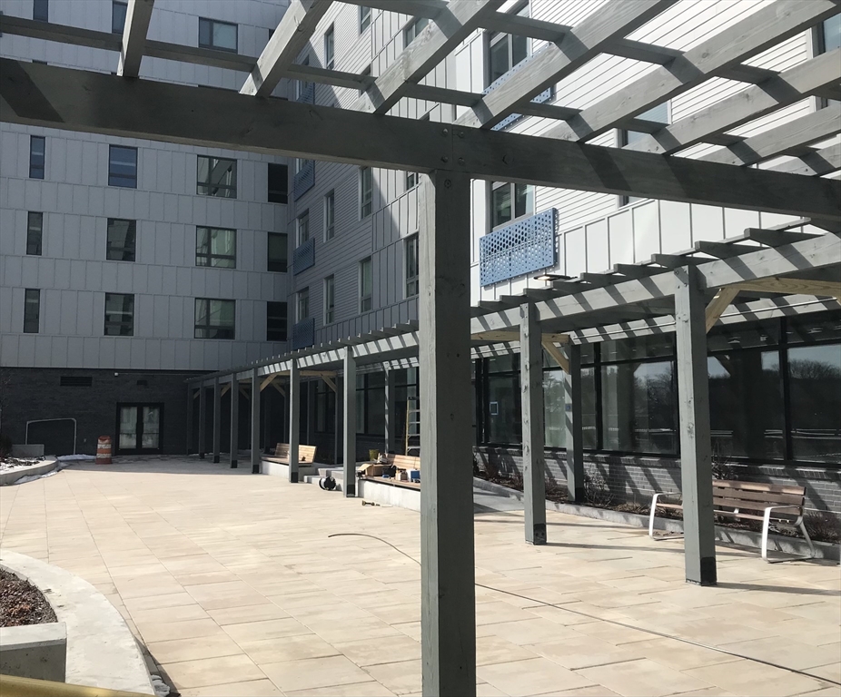 466 River Street, Unit 308 Boston, MA 02126 - Photo 11 of 17 a outdoor view of a building