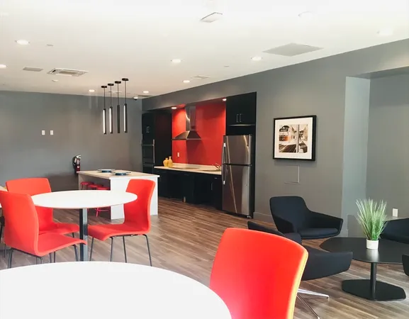 a view of a big room with a refrigerator