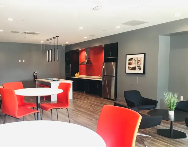 a view of a big room with a refrigerator