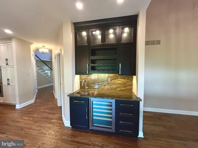 a view of a kitchen cabinets and wooden floor