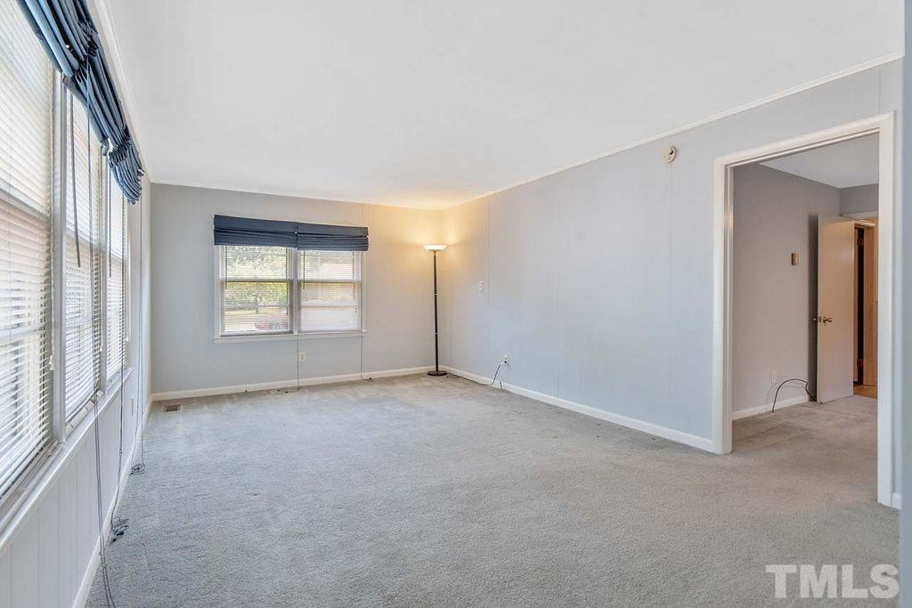 3806 Lee Road Raleigh, NC 27604 - Photo 13 of 33 an empty room with windows