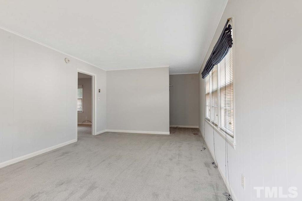 3806 Lee Road Raleigh, NC 27604 - Photo 15 of 33 an empty room with windows