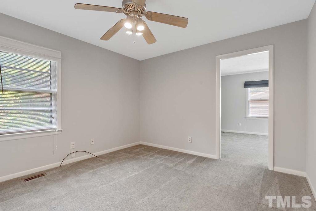 3806 Lee Road Raleigh, NC 27604 - Photo 21 of 33 an empty room with windows and fan