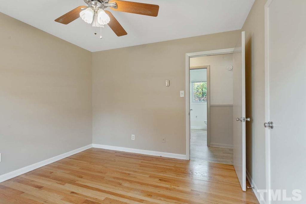 3806 Lee Road Raleigh, NC 27604 - Photo 26 of 33 wooden floor in an empty room with a window