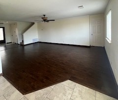 14909 Nuttall Drive Austin, TX 78724 - Photo 4 of 13 Unfurnished living room with light wood-style flooring and ceiling fan