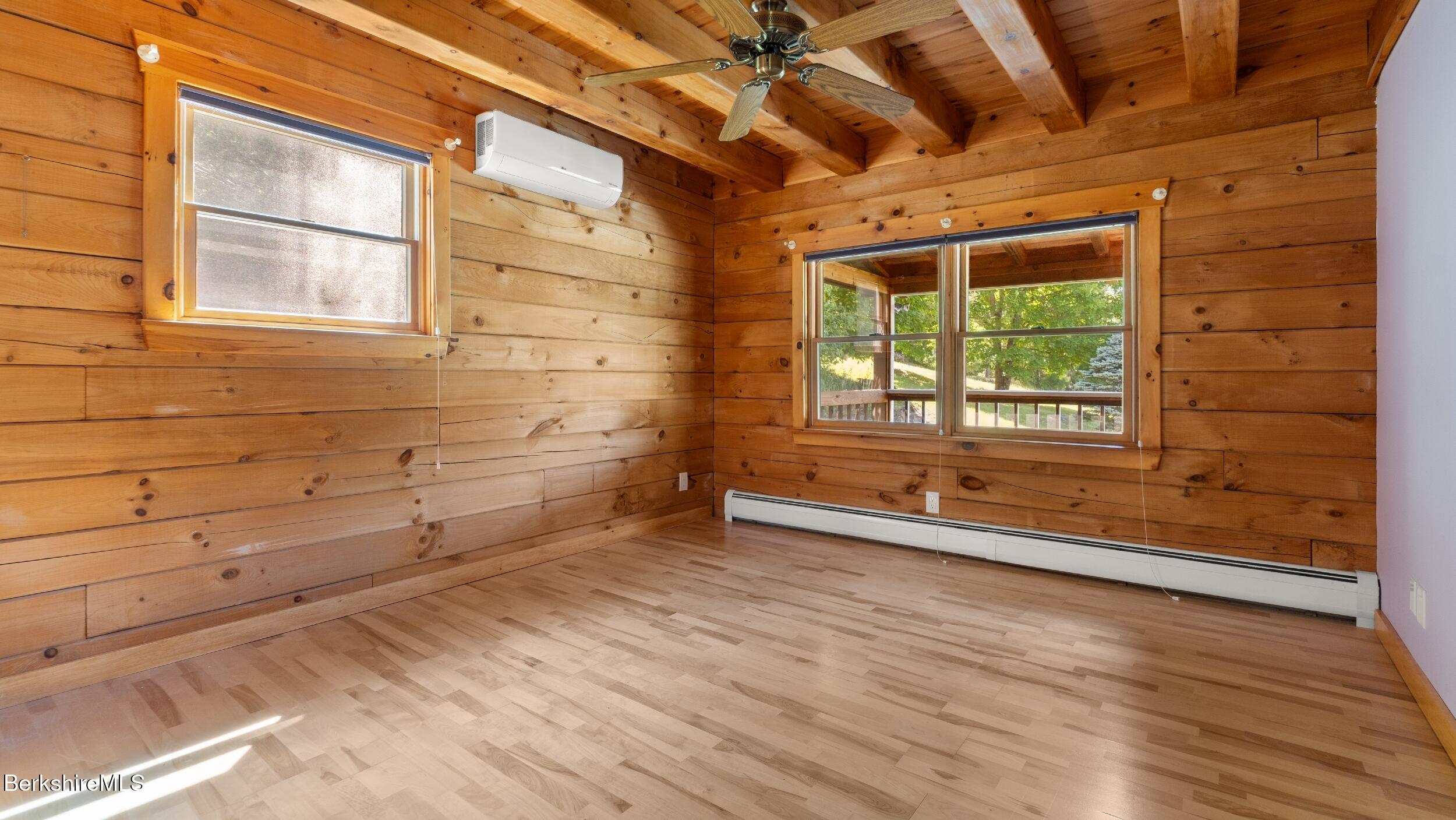 134 Hurlburt Road Great Barrington, MA 01230 - Photo 50 of 50 an empty room with wooden floor and windows