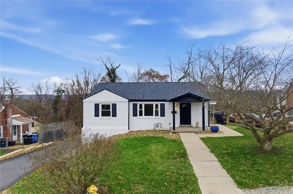 front view of a house with a yard