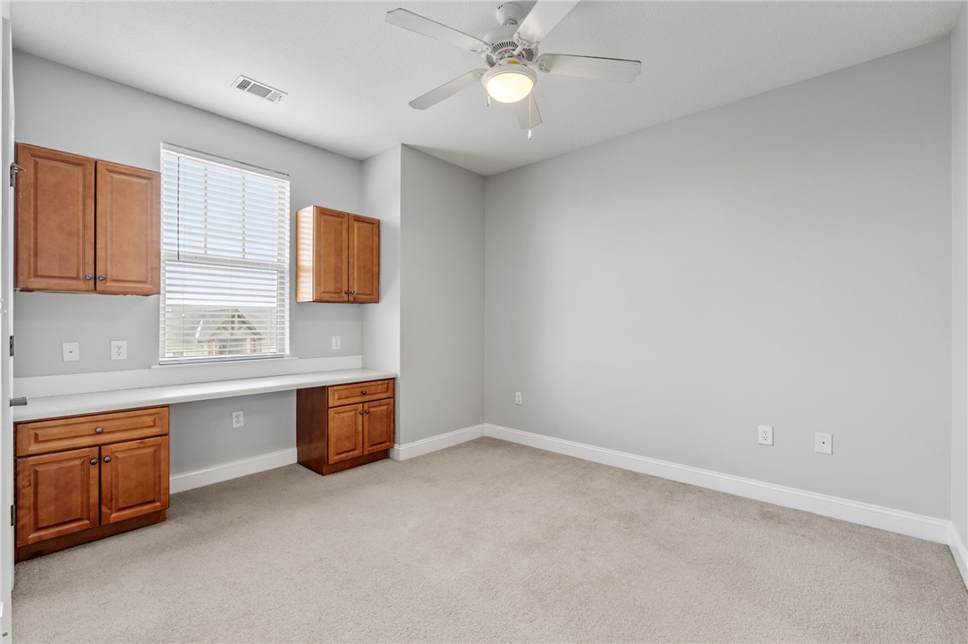 1432 Gadwall Way Seneca, SC 29678 - Photo 11 of 35 This spacious room features a built-in desk, creating a practical workspace for various activities.