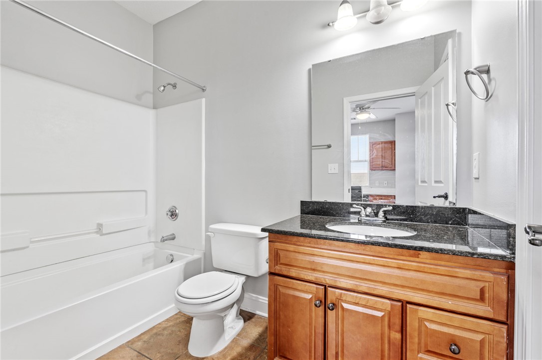 1432 Gadwall Way Seneca, SC 29678 - Photo 14 of 35 This functional bathroom features a clean design with practical fixtures and a warm wooden vanity.
