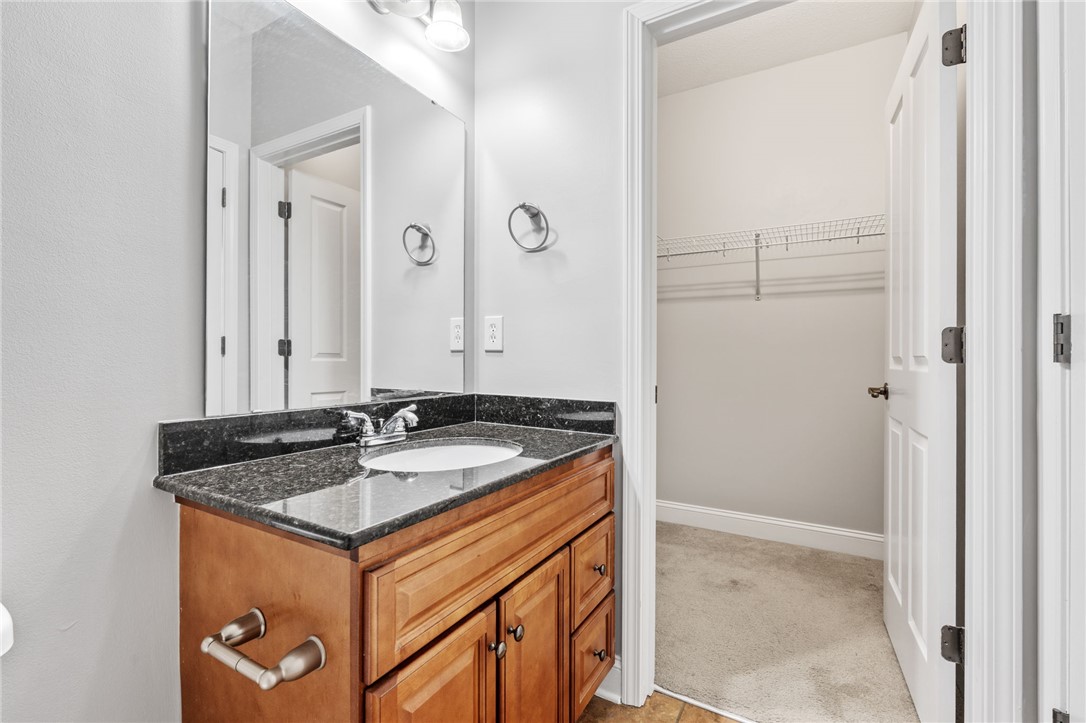 1432 Gadwall Way Seneca, SC 29678 - Photo 15 of 35 This bathroom features a sleek vanity with ample storage and a convenient walk-in closet.