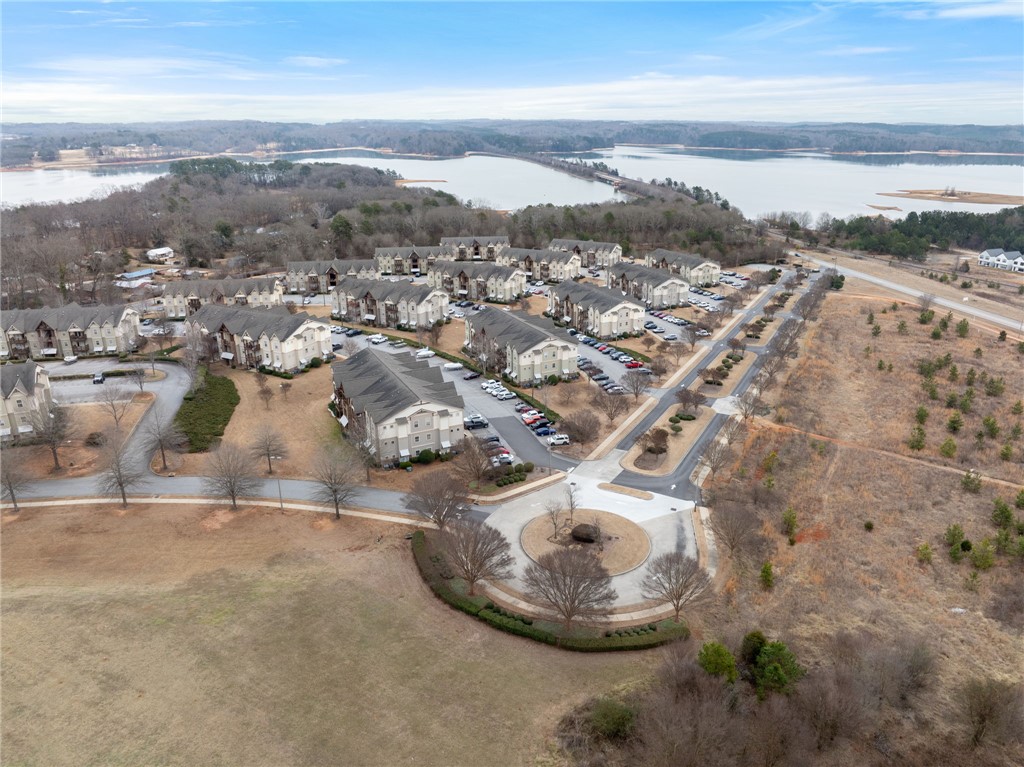 1432 Gadwall Way Seneca, SC 29678 - Photo 9 of 35 An aerial perspective reveals a serene community nestled beside a sprawling lake, offering peaceful living.
