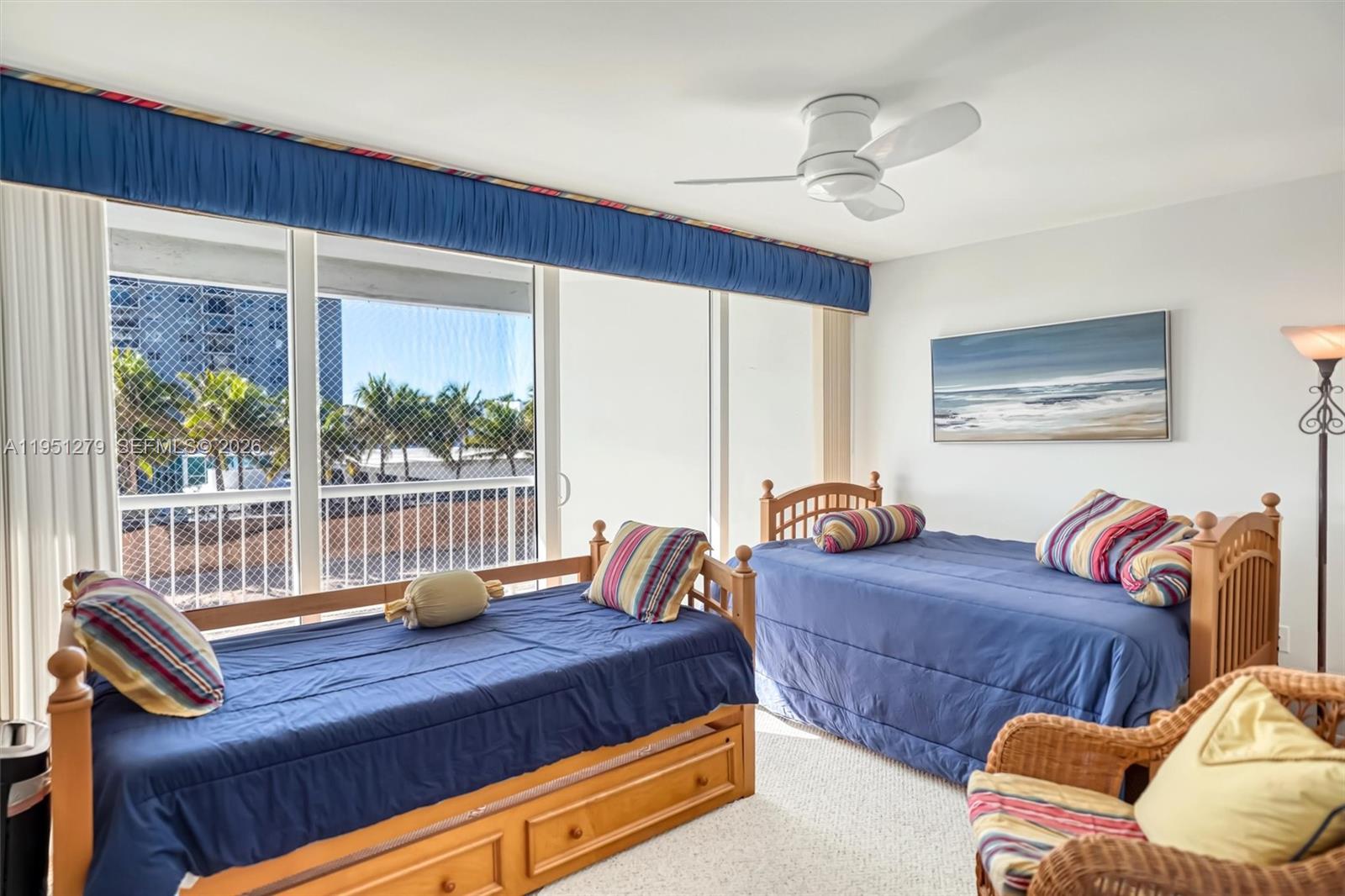 9341 Collins Avenue, Unit 201 Surfside, FL 33154 - Photo 22 of 34 a bedroom with furniture and large window