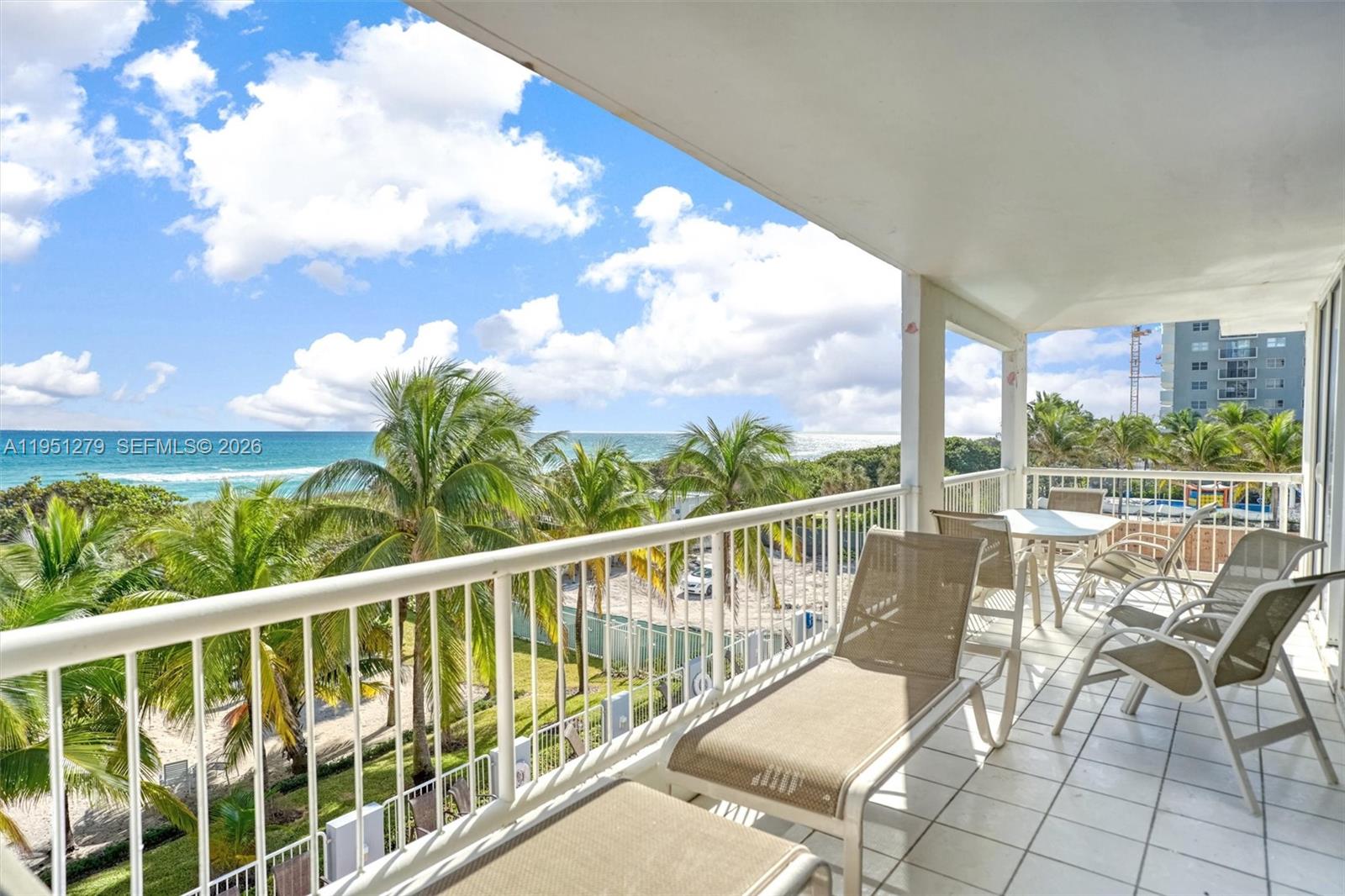 9341 Collins Avenue, Unit 201 Surfside, FL 33154 - Photo 26 of 34 a view of a chairs and table in the balcony